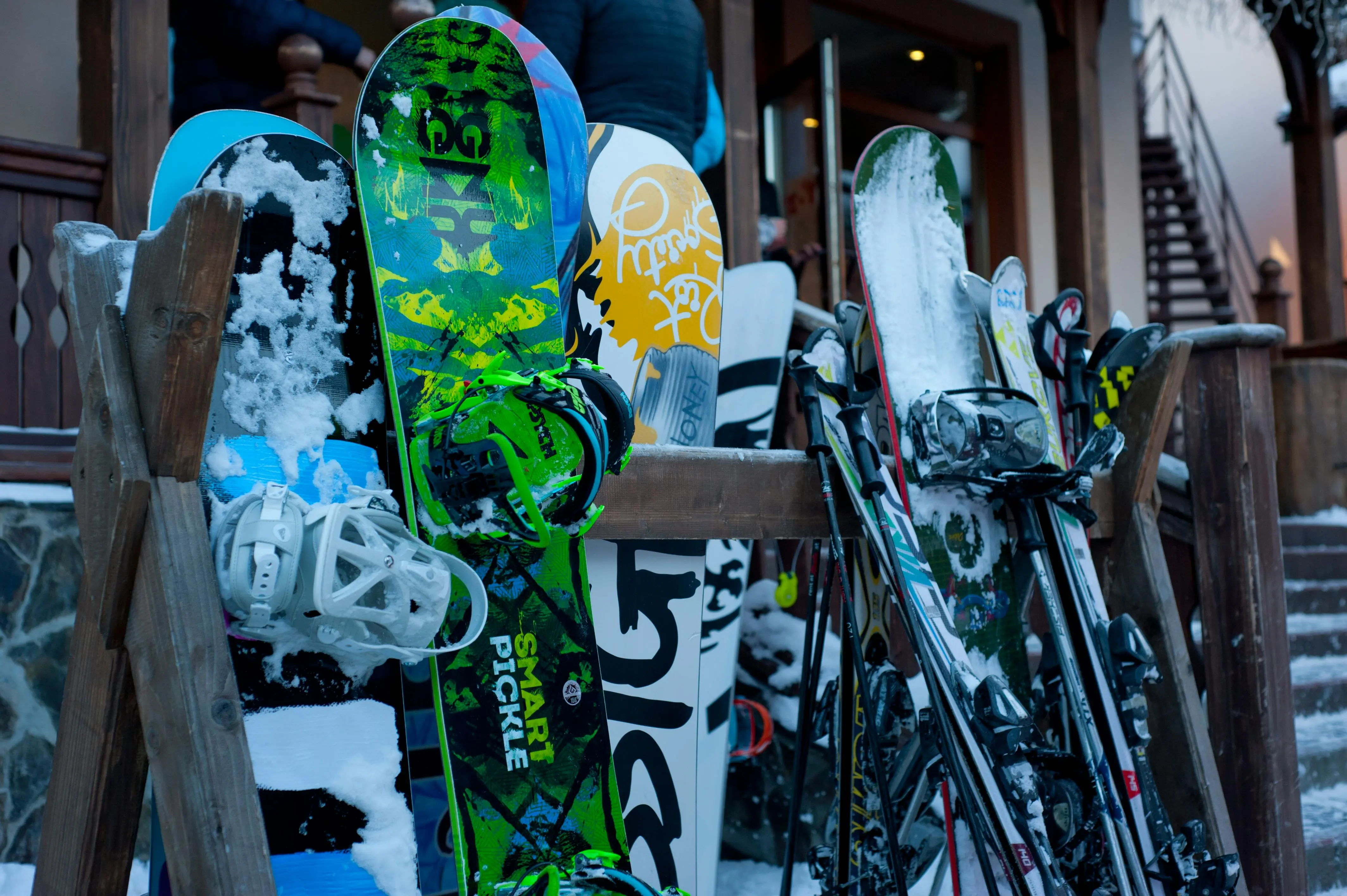 snowboard and skis on a rack