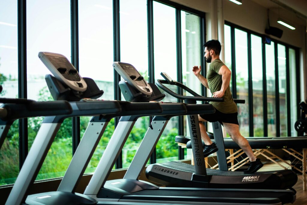 man running on a treadmill in the gym 