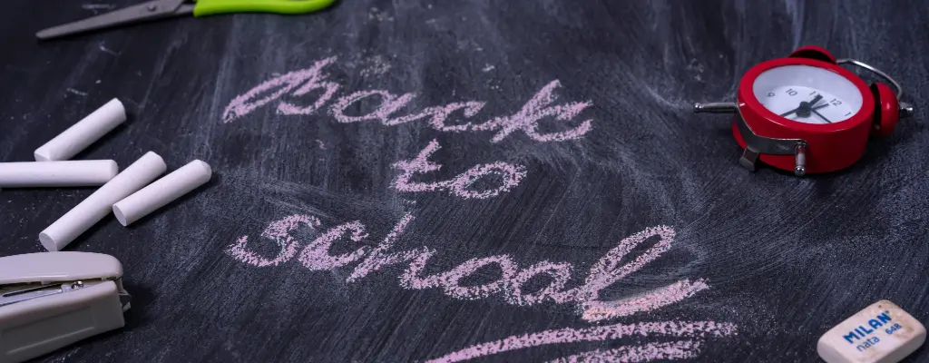 "Back To School" written on a black board