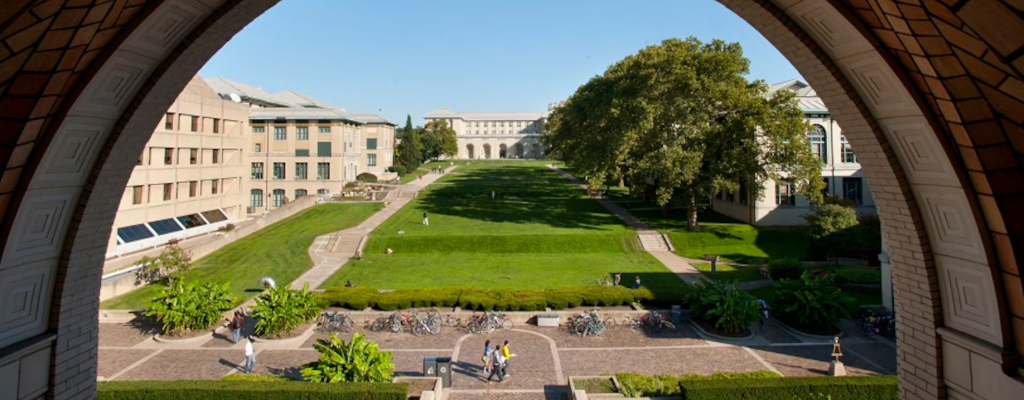 a gat with students standing and buildings